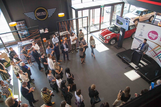 Mcee Jon Bridges welcomes guests to MINI Garage.