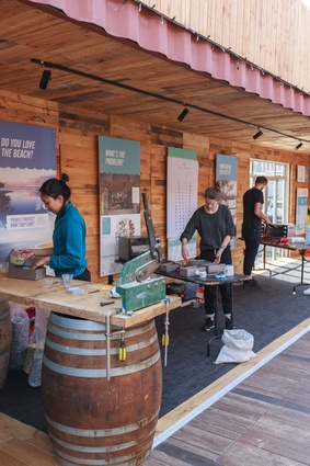 Participants at the ‘Critical Manufactory’ reusing plastic to create objects and furniture, held at the Sustainable Coastlines flagship in Wynyard Quarter.