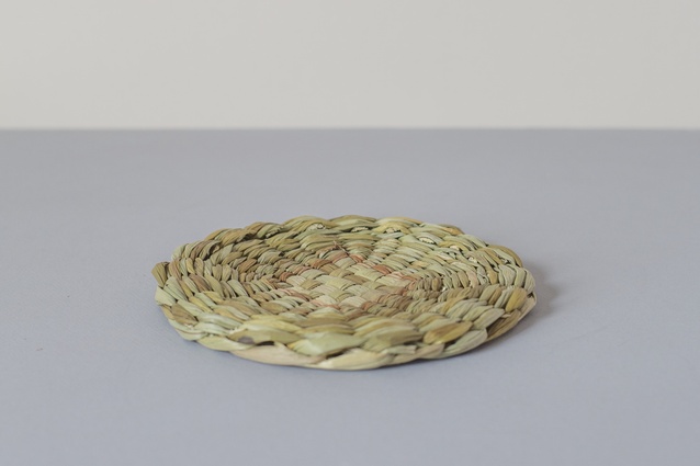 Circular rush table mat | <a href="http://www.everyday-needs.com/products/circular-rush-table-mat-large" target="_blank"><u> $53 from Everyday Needs.</u></a>